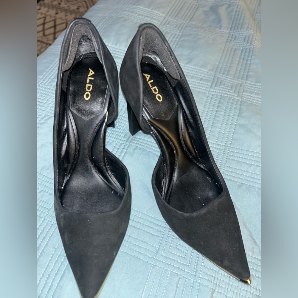 A slender block heel adds contemporary allure to this classic pump silhouette.